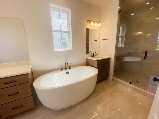 6511 W Lake Ave, South Jordan, UT 84009 - bathroom featuring a shower stall, a freestanding bath, and vanity