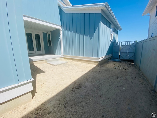 6511 W Lake Ave, South Jordan, UT 84009 - view of side of home featuring board and batten siding and a gate