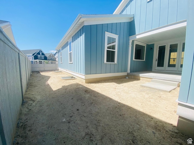 6511 W Lake Ave, South Jordan, UT 84009 - view of side of property with board and batten siding and a fenced backyard