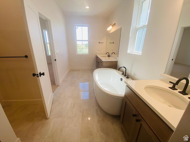 6511 W Lake Ave, South Jordan, UT 84009 - bathroom with a freestanding tub and two vanities