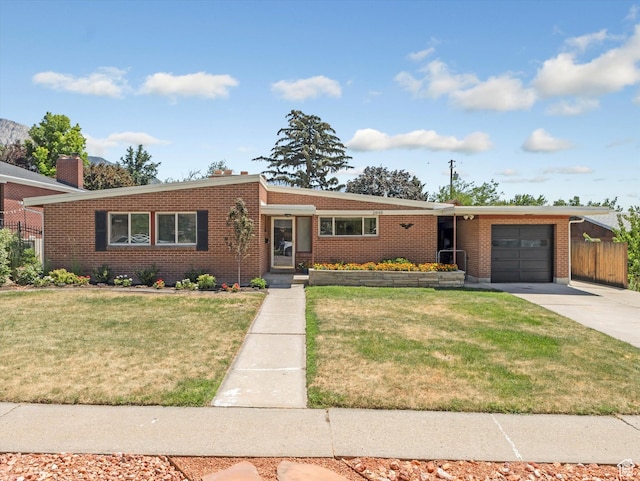 2848 E Loran Heights Dr, Millcreek, UT 84109 - view of front of property with a garage, driveway, and brick siding