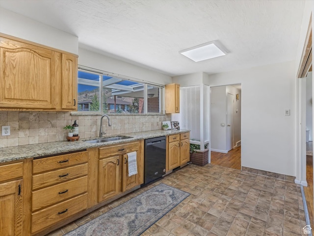 2848 E Loran Heights Dr, Millcreek, UT 84109 - kitchen with dishwasher, tasteful backsplash, light stone counters, and stone finish floors