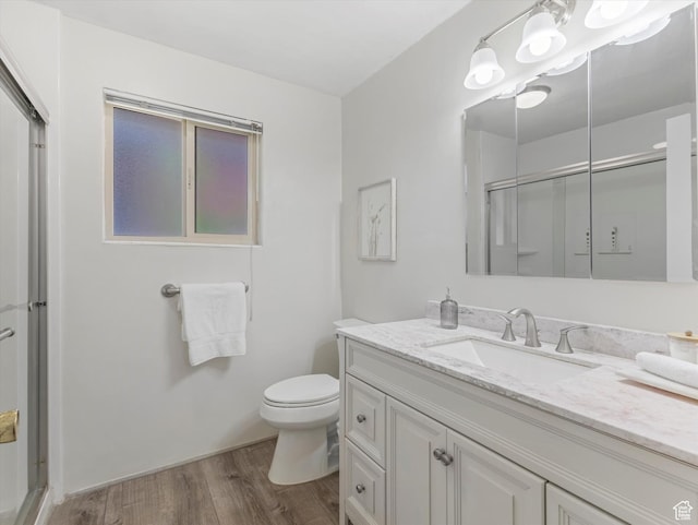 2848 E Loran Heights Dr, Millcreek, UT 84109 - full bathroom featuring vanity, a stall shower, and wood finished floors