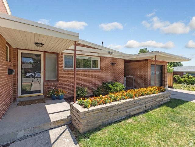 2848 E Loran Heights Dr, Millcreek, UT 84109 - entrance to property featuring brick siding and a lawn