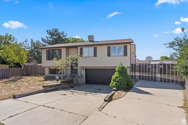 5987 S Salem Cir, Salt Lake City, UT 84118 - split foyer home with concrete driveway and a garage