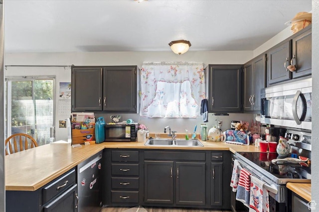 5987 S Salem Cir, Salt Lake City, UT 84118 - kitchen with appliances with stainless steel finishes, a peninsula, and light countertops