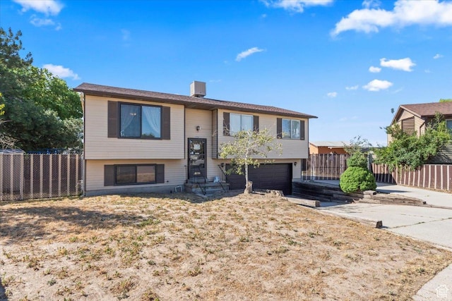 5987 S Salem Cir, Salt Lake City, UT 84118 - split foyer home featuring a garage and entry steps