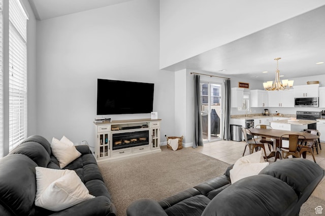 150 N 1100 E Unit 63, Washington, UT 84780 - living room featuring a chandelier, light tile patterned floors, recessed lighting, and a fireplace