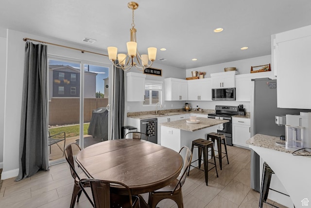150 N 1100 E Unit 63, Washington, UT 84780 - dining room featuring a chandelier and recessed lighting