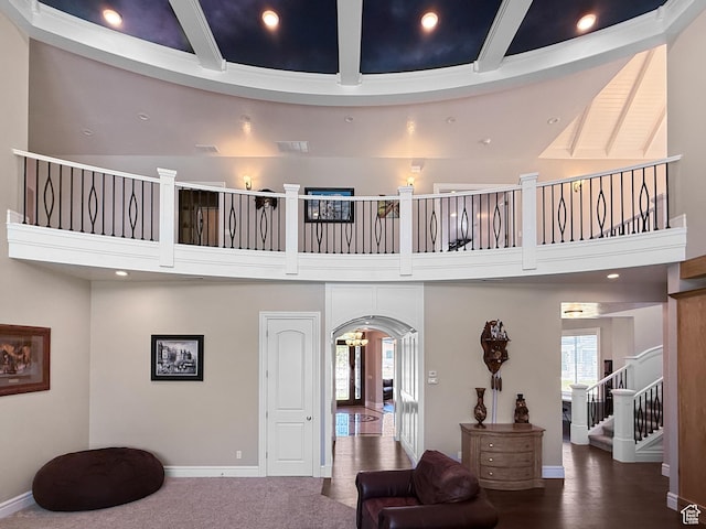 1645 E 6800 S, Uintah, UT 84405 - living room featuring a high ceiling, arched walkways, recessed lighting, beamed ceiling, and stairs