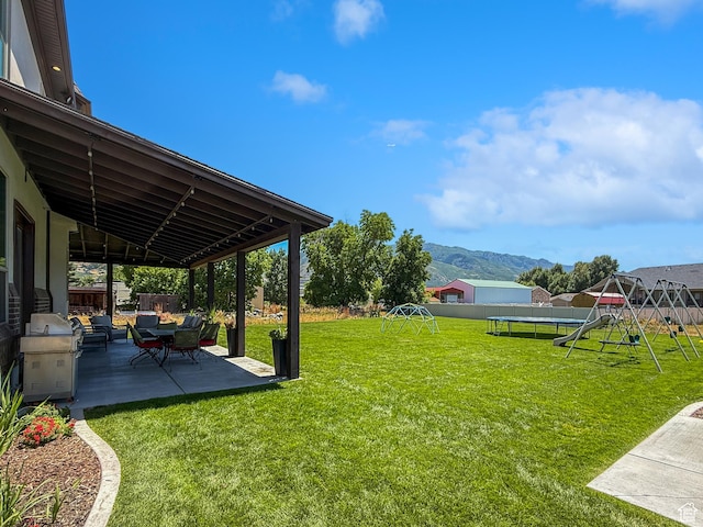 1645 E 6800 S, Uintah, UT 84405 - fenced yard featuring a playground, a patio area, a trampoline, and a mountain view