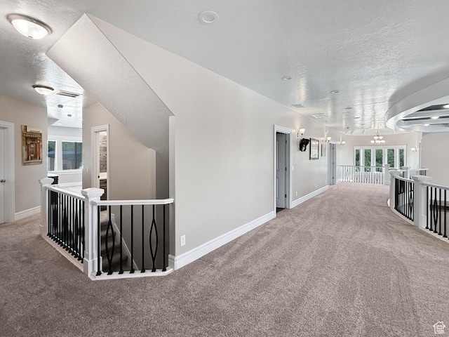1645 E 6800 S, Uintah, UT 84405 - hallway featuring an upstairs landing, carpet floors, a chandelier, and a textured ceiling