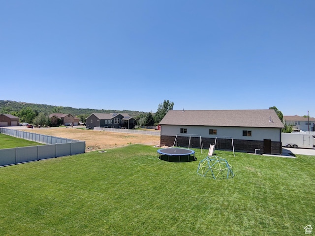 1645 E 6800 S, Uintah, UT 84405 - fenced backyard with a trampoline