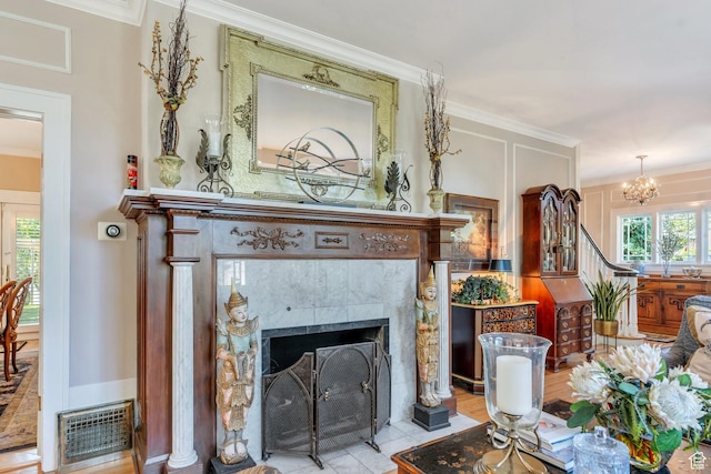 1120 E Yale Ave, Salt Lake City, UT 84105 - living room featuring crown molding, a fireplace, and a chandelier
