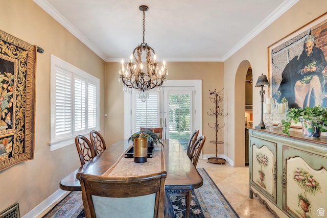 1120 E Yale Ave, Salt Lake City, UT 84105 - dining space with arched walkways, a chandelier, and crown molding