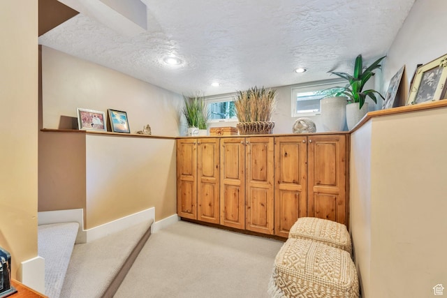 1120 E Yale Ave, Salt Lake City, UT 84105 - living area featuring a textured ceiling and light colored carpet