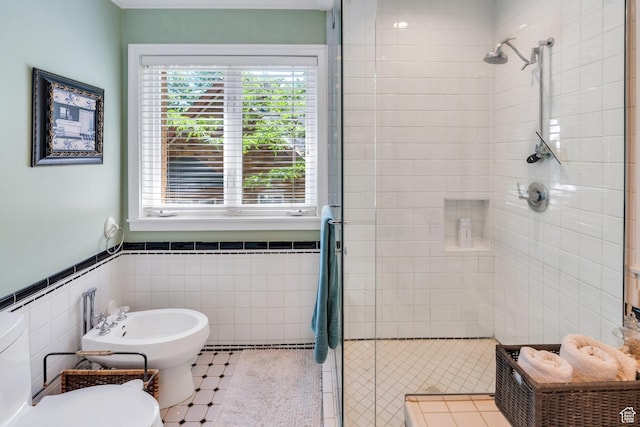 1120 E Yale Ave, Salt Lake City, UT 84105 - bathroom with a shower stall, a bidet, tile walls, and a wainscoted wall