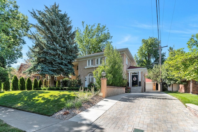 1120 E Yale Ave, Salt Lake City, UT 84105 - view of front of house featuring decorative driveway, stucco siding, and a front yard