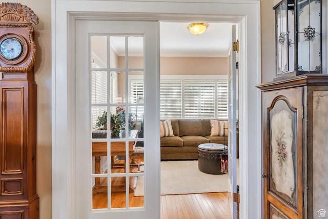 1120 E Yale Ave, Salt Lake City, UT 84105 - living area with ornamental molding, healthy amount of natural light, and hardwood / wood-style flooring