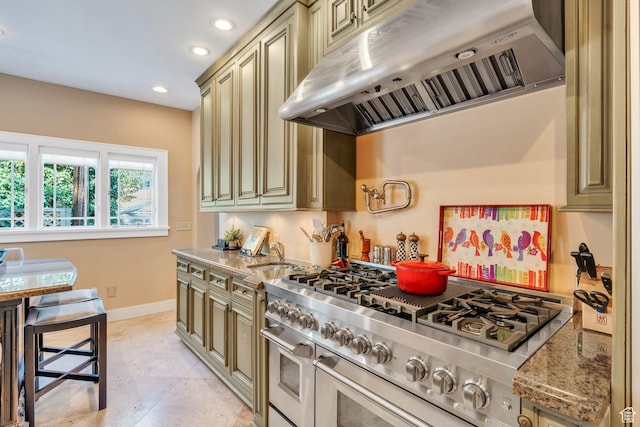 1120 E Yale Ave, Salt Lake City, UT 84105 - kitchen featuring under cabinet range hood, double oven range, cream cabinetry, light stone counters, and recessed lighting