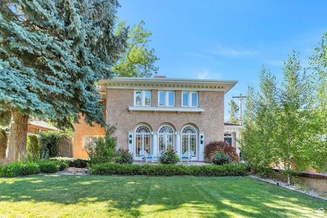 1120 E Yale Ave, Salt Lake City, UT 84105 - italianate house with a front lawn and stucco siding