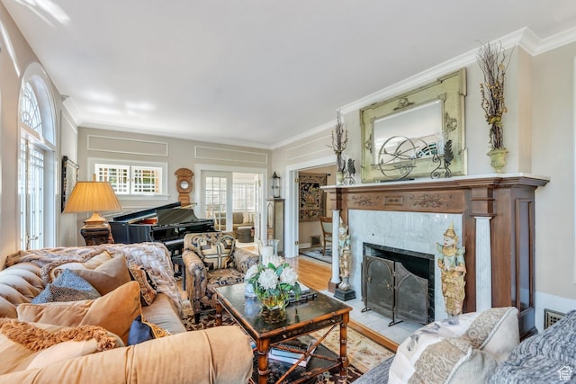 1120 E Yale Ave, Salt Lake City, UT 84105 - living area featuring ornamental molding, healthy amount of natural light, a tile fireplace, and wood finished floors