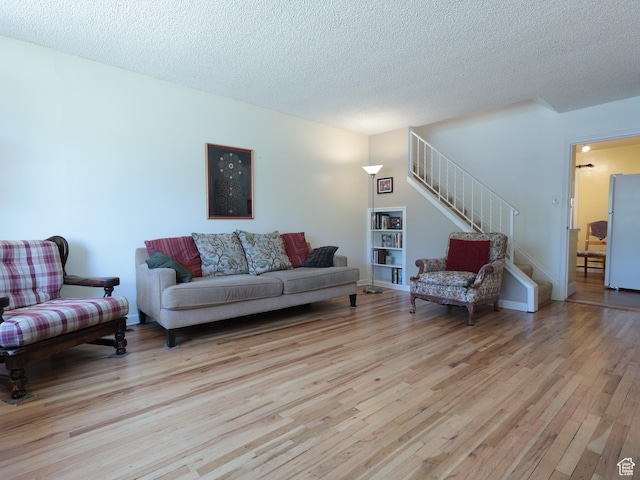 948 E 150 N, Provo, UT 84606 - living room featuring light wood finished floors, stairway, and a textured ceiling