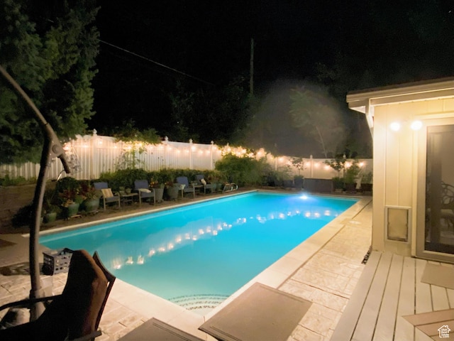 3491 S Monte Verde Dr E, Millcreek, UT 84109 - pool at night with a fenced backyard