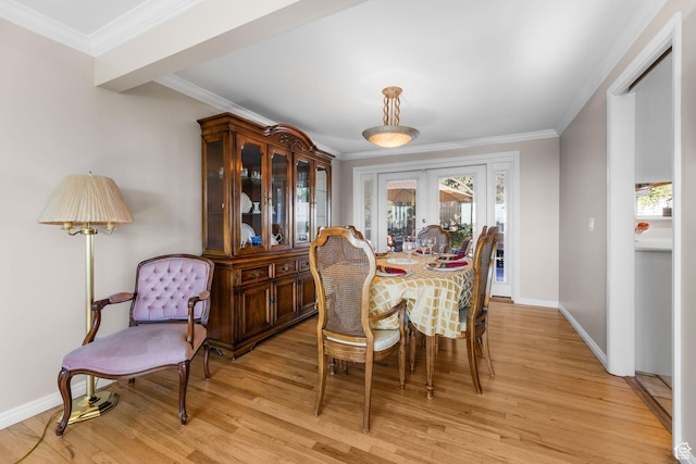 3491 S Monte Verde Dr E, Millcreek, UT 84109 - dining space featuring french doors, crown molding, and light wood-style flooring