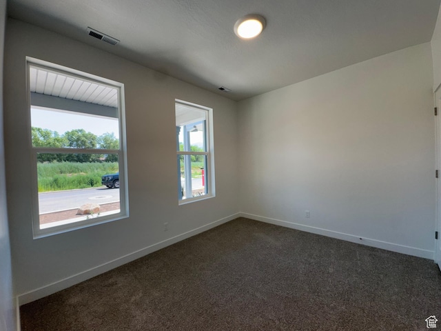 1464 N 1875 W Unit 149, Layton, UT 84041 - spare room featuring dark colored carpet and baseboards