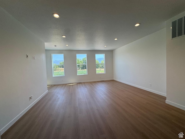 1464 N 1875 W Unit 149, Layton, UT 84041 - empty room with dark wood-type flooring, recessed lighting, and a textured ceiling