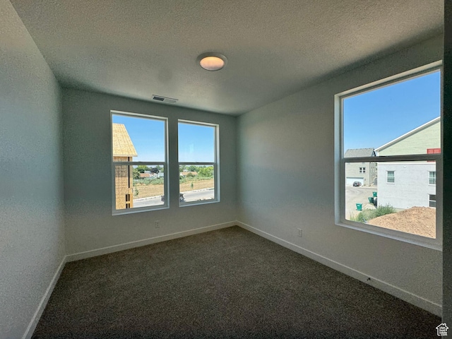 1464 N 1875 W Unit 149, Layton, UT 84041 - spare room with a textured ceiling and dark carpet
