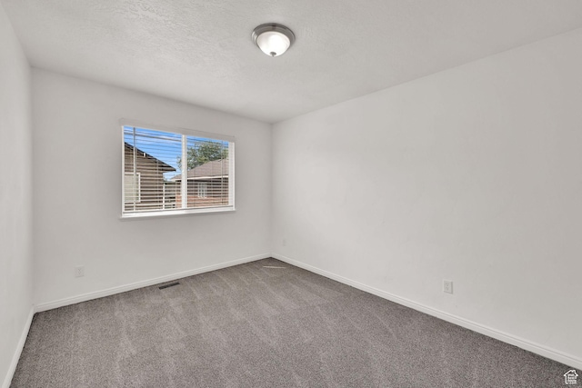 1568 N 565 W Unit 104, Logan, UT 84341 - carpeted empty room with baseboards and a textured ceiling