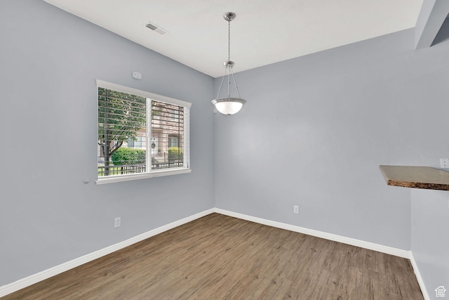 1568 N 565 W Unit 104, Logan, UT 84341 - unfurnished room featuring wood finished floors and baseboards