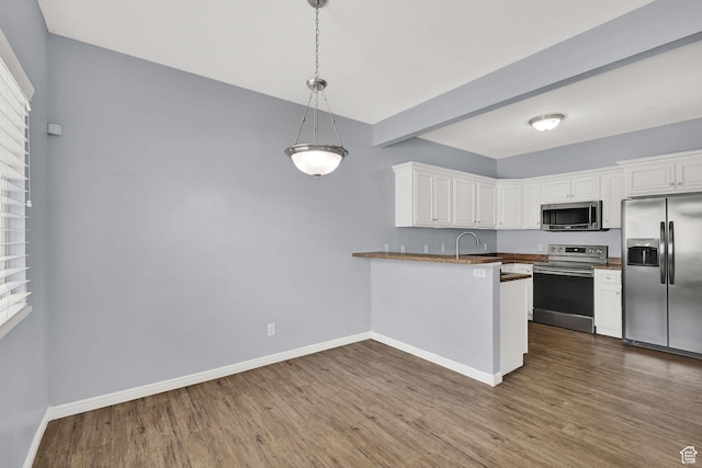 1568 N 565 W Unit 104, Logan, UT 84341 - kitchen featuring stainless steel appliances, white cabinets, dark wood finished floors, and healthy amount of natural light