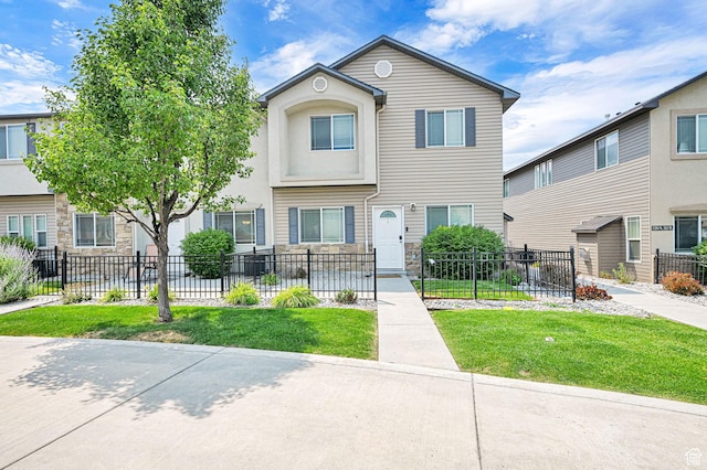 1568 N 565 W Unit 104, Logan, UT 84341 - townhome / multi-family property with a fenced front yard