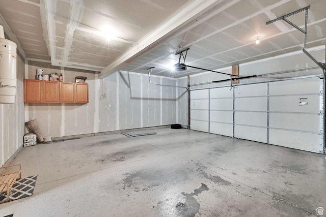 1568 N 565 W Unit 104, Logan, UT 84341 - garage with a central vacuum unit and a garage door opener