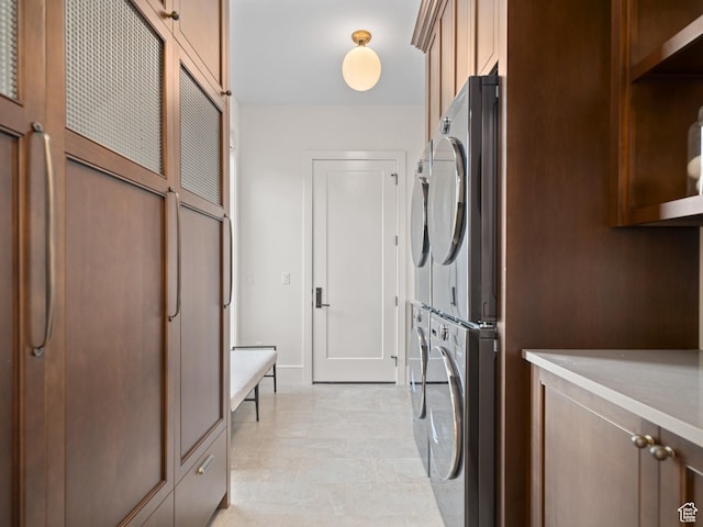 322 S 7900th St E Unit 5, Huntsville, UT 84317 - laundry room with stacked washer / dryer and cabinet space