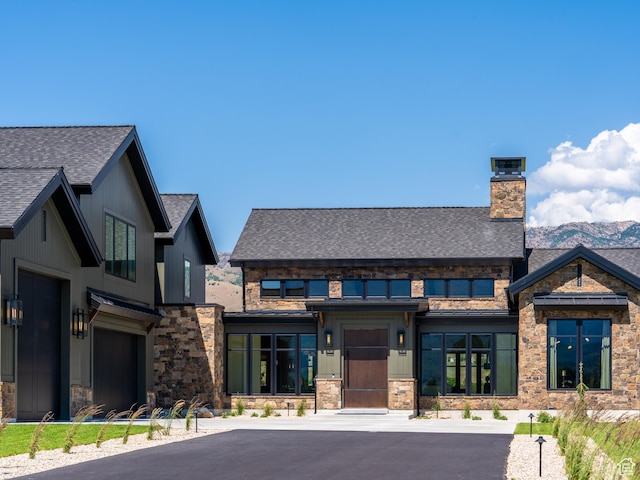 322 S 7900th St E Unit 5, Huntsville, UT 84317 - view of front facade featuring a chimney, stone siding, and roof with shingles