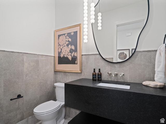 322 S 7900th St E Unit 5, Huntsville, UT 84317 - half bathroom featuring vanity, tile walls, and wainscoting
