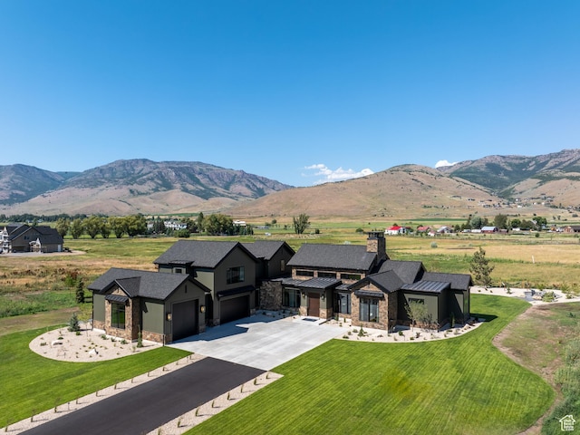 322 S 7900th St E Unit 5, Huntsville, UT 84317 - view of front of property with stone siding, a garage, driveway, a standing seam roof, and a mountain view