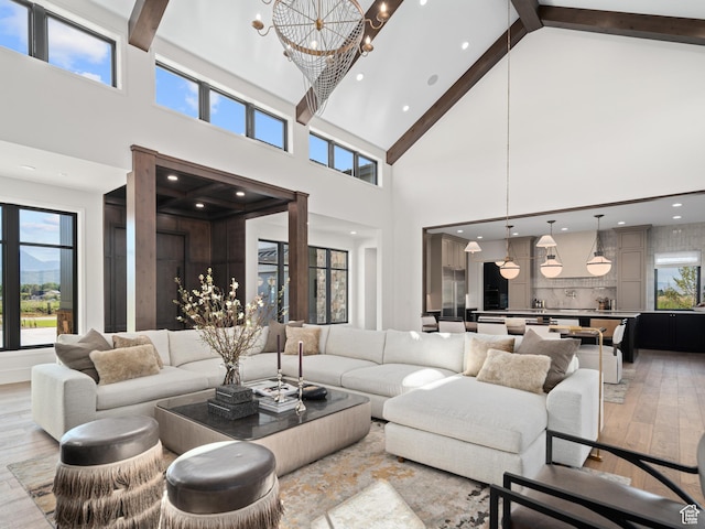 322 S 7900th St E Unit 5, Huntsville, UT 84317 - living area featuring high vaulted ceiling, light wood-style flooring, beam ceiling, and a chandelier