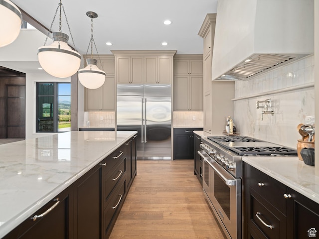 322 S 7900th St E Unit 5, Huntsville, UT 84317 - kitchen with custom exhaust hood, high end appliances, recessed lighting, backsplash, and light wood-type flooring
