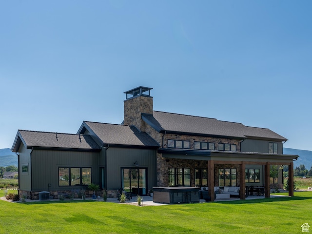 322 S 7900th St E Unit 5, Huntsville, UT 84317 - back of property with a hot tub, a patio area, a lawn, an outdoor living space, and a chimney