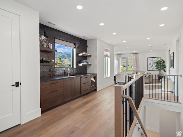 322 S 7900th St E Unit 5, Huntsville, UT 84317 - indoor wet bar with light wood finished floors, recessed lighting, tasteful backsplash, and beverage cooler