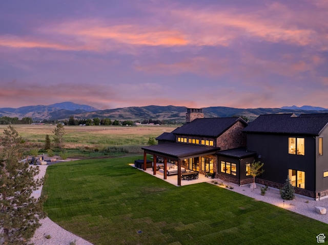 322 S 7900th St E Unit 5, Huntsville, UT 84317 - back of property featuring a mountain view, a patio, a yard, a standing seam roof, and a metal roof