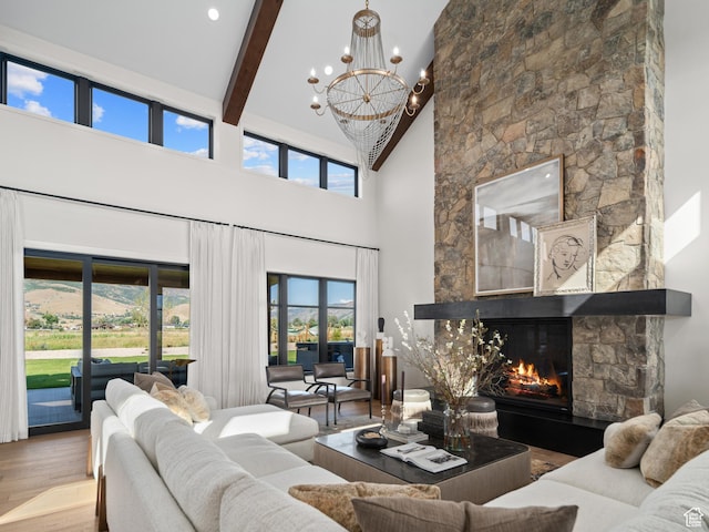 322 S 7900th St E Unit 5, Huntsville, UT 84317 - living room with high vaulted ceiling, a chandelier, wood finished floors, beamed ceiling, and a stone fireplace