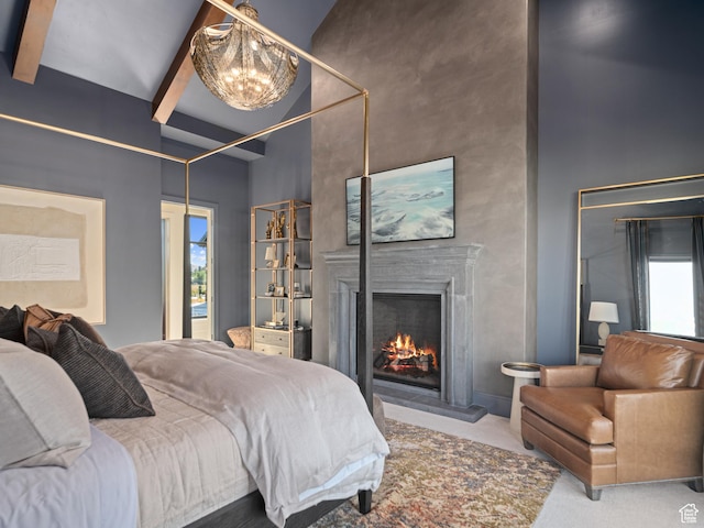322 S 7900th St E Unit 5, Huntsville, UT 84317 - bedroom with a warm lit fireplace, a chandelier, beam ceiling, and a towering ceiling