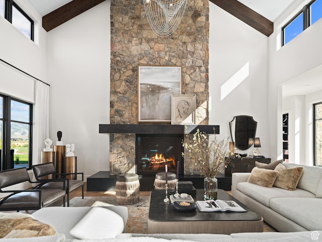 322 S 7900th St E Unit 5, Huntsville, UT 84317 - living area featuring high vaulted ceiling, a stone fireplace, beam ceiling, and wood finished floors