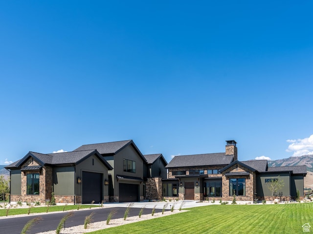 322 S 7900th St E Unit 5, Huntsville, UT 84317 - view of front of home with stone siding, a front yard, asphalt driveway, and a chimney